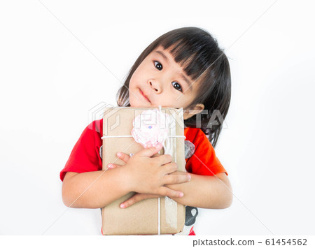 Happy Asian little child girl hugging a gift box 61454562