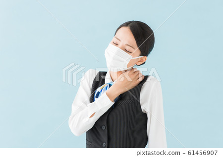 Working woman suffering from stiff shoulders 61456907