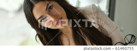Beautiful smiling girl at workplace look in camera portrait Beautiful smiling girl at workplace look in camera portrait 61460755