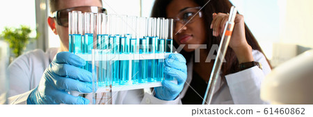 A male chemist holds test tube of glass A male chemist holds test tube of glass 61460862