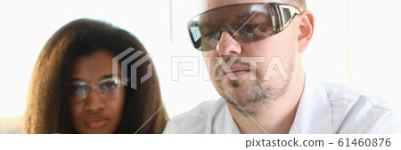 A male chemist holds test tube of glass A male chemist holds test tube of glass 61460876