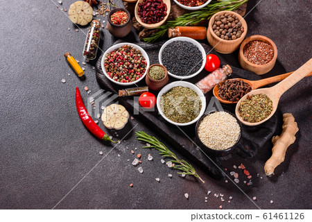 Spices and herbs over black stone background 61461126