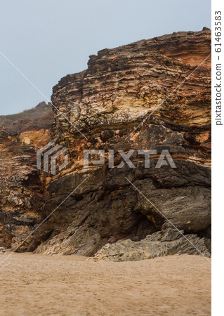 Beach of Nazare, Portugal. Cliff and sand Beach of Nazare, Portugal. Cliff and sand 61463583
