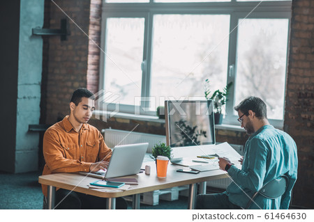 Pleasant smart men being involved in their tasks 61464630