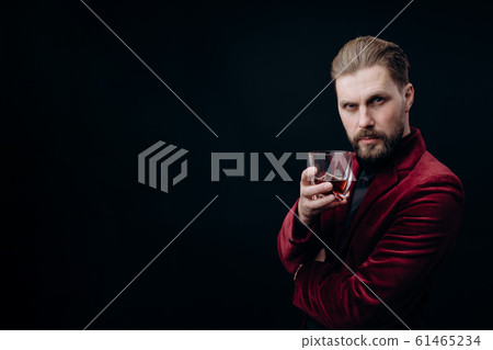 Handsome Mature Man in Vinous Jacket With Whiskey Toasting 61465234