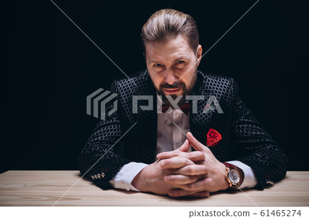 Mature Stylish Man With Forehead Scar Giving Suspicious Look Mature Stylish Man With Forehead Scar Giving Suspicious Look 61465274