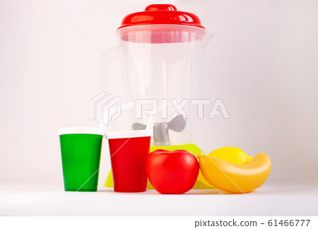 Kids blender on a white background. Childs toy plastic food with drink cup. Healthy eating, raw smoothie, vegan diet, playing with babies. Parents teach children to build good habits.Kitchen play set. 61466777