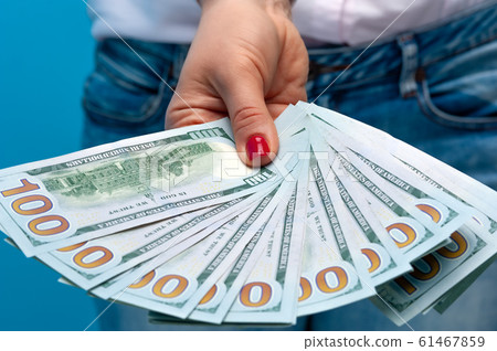 Hands of an unidentified woman with red manicure Hands of an unidentified woman with red manicure 61467859