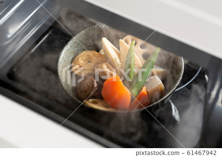 Stewed Japanese food warmed in a microwave Stewed Japanese food warmed in a microwave 61467942