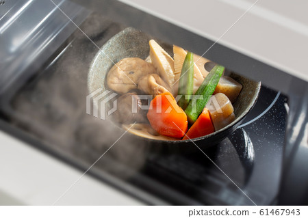 Stewed Japanese food warmed in a microwave 61467943