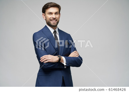 studio photo of young handsome stylish businessman wearing suit studio photo of young handsome stylish businessman wearing suit 61468426
