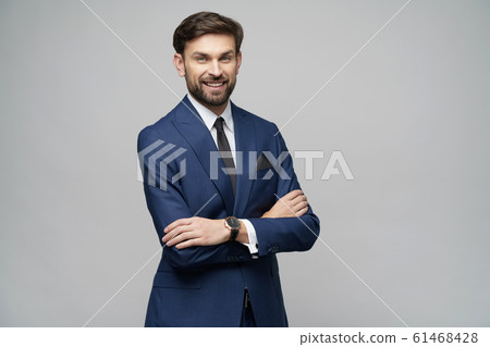 studio photo of young handsome stylish businessman wearing suit studio photo of young handsome stylish businessman wearing suit 61468428