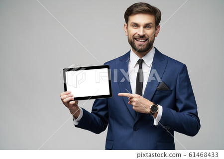 Young Businessman presenting digital tablet pc pad with blank screen 61468433