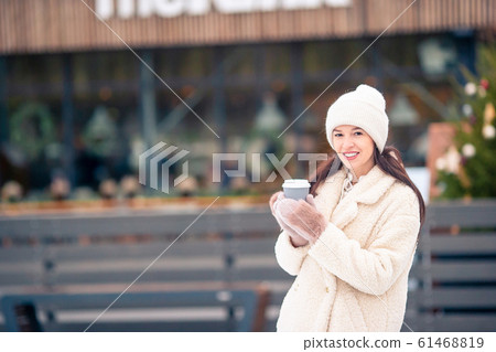 Smiling young girl skating on ice rink outdoors Smiling young girl skating on ice rink outdoors 61468819