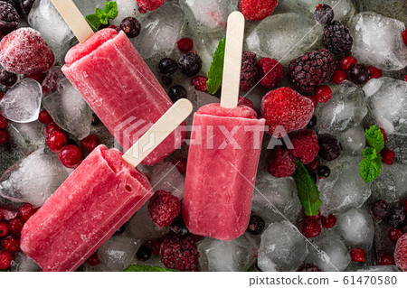Homemade berry popsicles 61470580