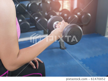 women hand and dumbell in gym women hand and dumbell in gym 61470852