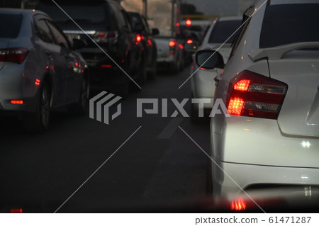 traffic jam on night road, car driving in rush hour of city life traffic jam on night road, car driving in rush hour of city life 61471287