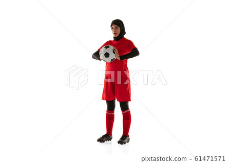 Arabian female soccer or football player isolated on white studio background Arabian female soccer or football player isolated on white studio background 61471571