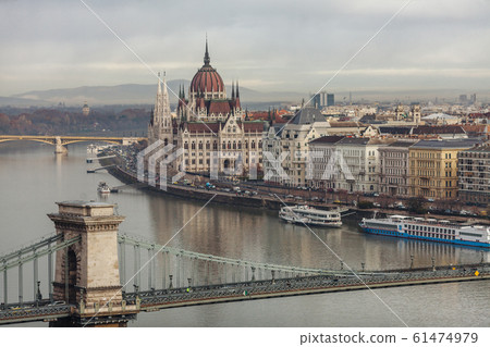 Morning in Budapest. Panoramic view of the city, Szechenyi Bridge and the building of the Budapest Parliament. Morning in Budapest. Panoramic view of the city, Szechenyi Bridge and the building of the Budapest Parliament. 61474979
