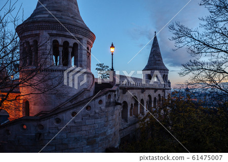 Towers of the Fisherman's Bastion against the background of a dawn sky. Budapest, Hungary 61475007