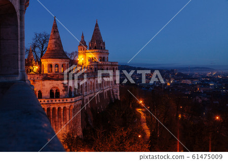 Towers of the Fisherman's Bastion against the background of a dawn sky. Budapest, Hungary 61475009