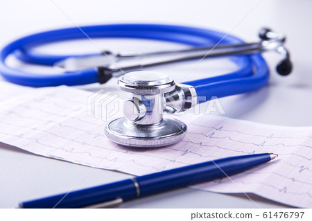 Medical stethoscope lying on cardiogram chart closeup. Medical help, prophylaxis, disease prevention or insurance concept. Cardiology care. 61476797