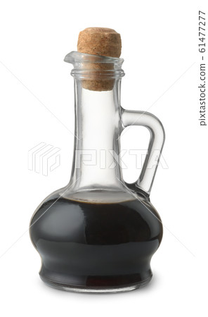 Side view of soy sauce in glass bottle Side view of soy sauce in glass bottle 61477277
