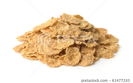Pile of organic bran flakes 61477283