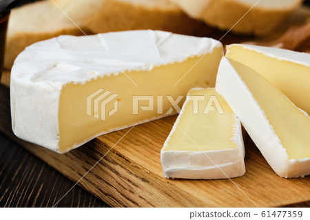 Close up of camembert or brie cheese Close up of camembert or brie cheese 61477359
