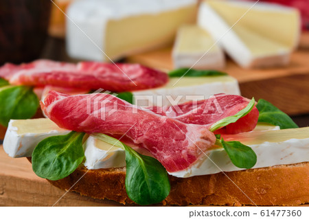 Sandwich with camembert and smoked bacon (macro Sandwich with camembert and smoked bacon (macro 61477360