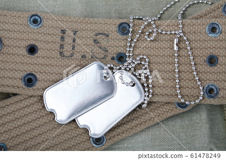 A pair of blank dog tags on U.S. Army uniform 61478249