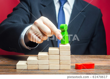A businessman replaces an employee with a new one on career ladder. Head Offset. Business optimization. Fight corruption. System recovery. Strengthening change of power, capture control of business. 61478617