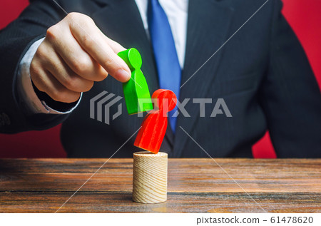 A businessman is replacing an old employee with a new one. Head Offset. Business optimization. Fight corruption. System recovery. Strengthening change of power, capture control of business. 61478620