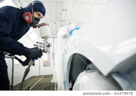 worker with spray gun in spray booth worker with spray gun in spray booth 61479478