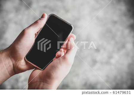 Smart cell phone in hand Smart cell phone in hand 61479631