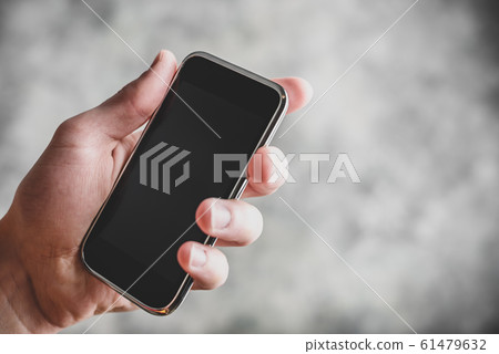 Smart cell phone in hand Smart cell phone in hand 61479632