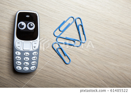 mobile phone paper clip table background mobile phone paper clip table background 61485522
