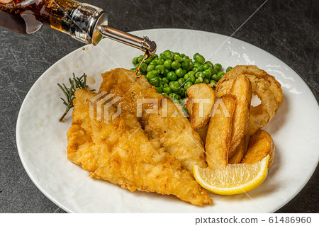 Fish and chips Typical homemade fish and chips Fish and chips Typical homemade fish and chips 61486960