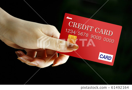 Hand with credit card 61492164