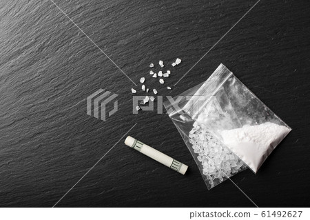drug powder in a plastic bag 61492627