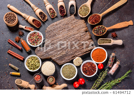 Spices and herbs over black stone background 61494712