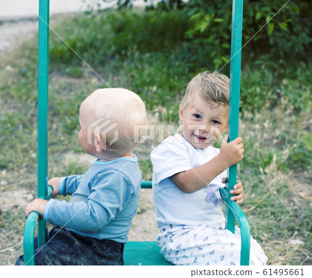 little cute boys playing together at playground happy smiling, lifestyle people concept little cute boys playing together at playground happy smiling, lifestyle people concept 61495661