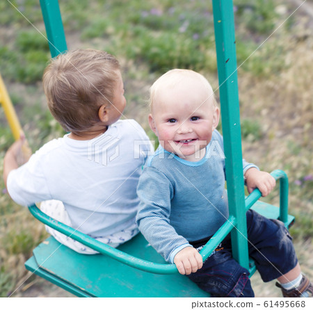 little cute boys playing together at playground happy smiling, lifestyle people concept little cute boys playing together at playground happy smiling, lifestyle people concept 61495668