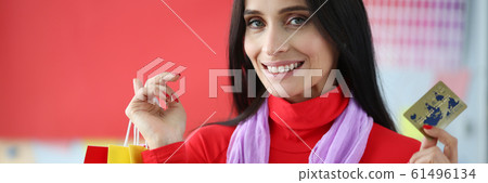 Joyful female shopaholic Joyful female shopaholic 61496134