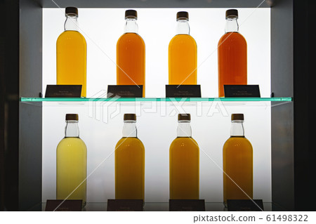 Raw whiskey wine lined on a shelf Raw whiskey wine lined on a shelf 61498322