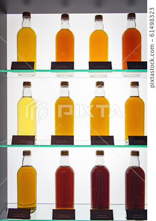 Raw whiskey wine lined on a shelf Raw whiskey wine lined on a shelf 61498323