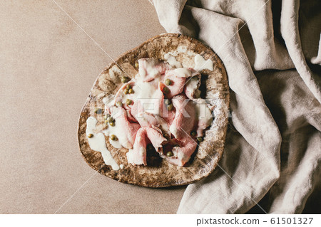 Vitello tonnato sliced veal Vitello tonnato sliced veal 61501327