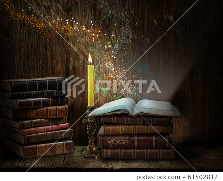 Opened magic book with magic light. Education 61502812