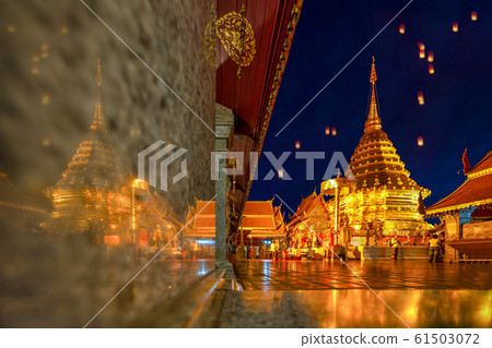 Beautiful Pagoda with reflection, Wat phra that doi suthep temple in Chiang mai thailand, the most famous temple at twilight, Yi Peng and Loy Krathong (Lantern Festival). 61503072