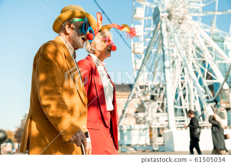 Elderly couple in clown costumes in the city Elderly couple in clown costumes in the city 61505034